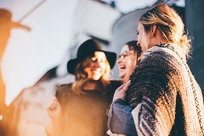 A group of women laugh together