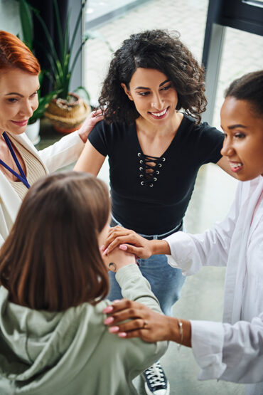 A group of women talk in a group therapy session at a fentanyl addiction treatment center.