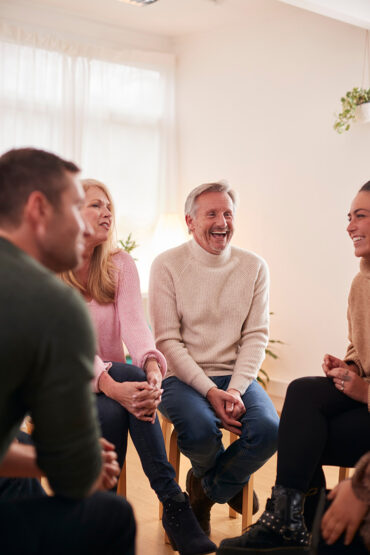 People at a VA CCN drug rehab participate in a group therapy session.