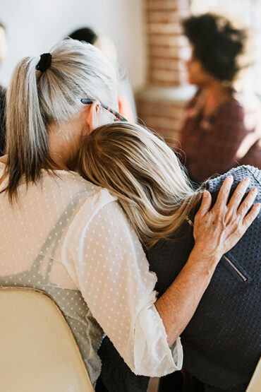 People support each other while in a drug rehab program.