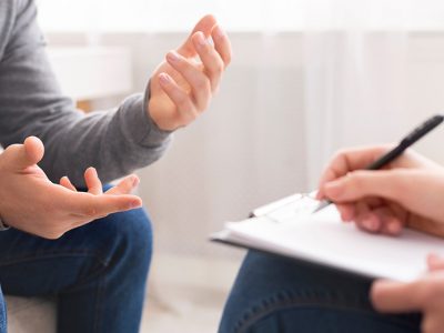 A person talks to their therapist at a fentanyl addiction treatment center.